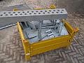 Yellow bin of metal parts